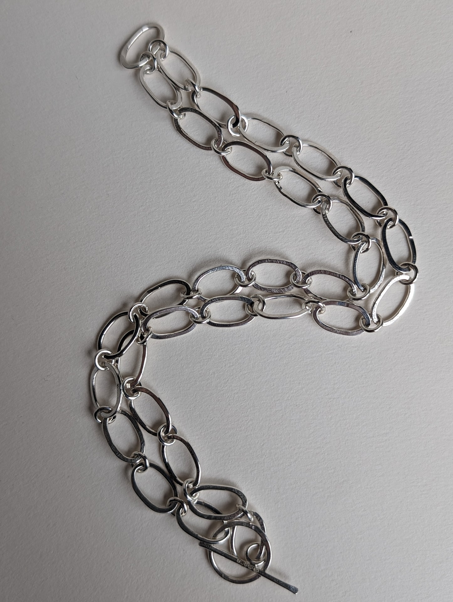 Oval and circle link chain